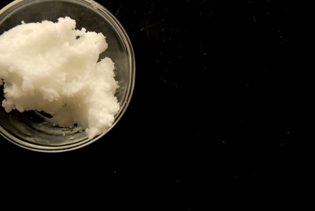 coconut oil in a glass dish for Hard Crack Chocolate Sauce